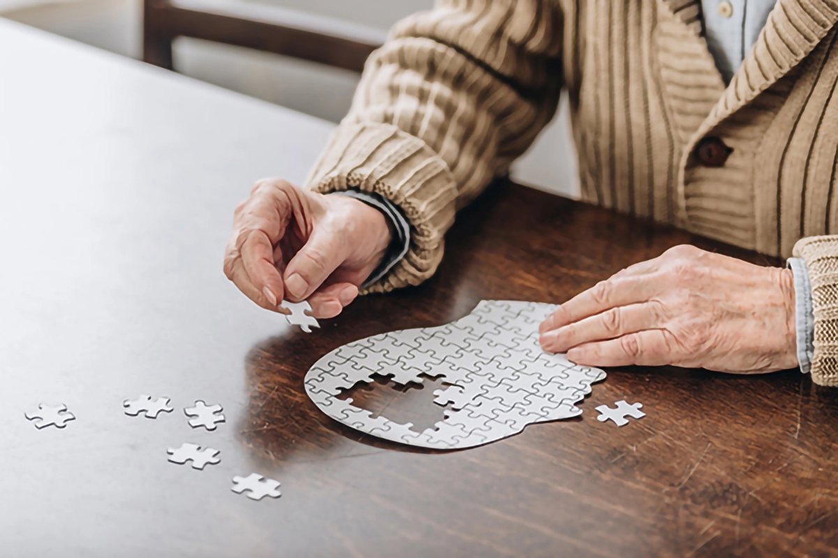 image depicting a patient with dementia doing a jigsaw