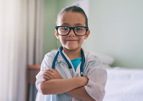 A child dressed as a doctor